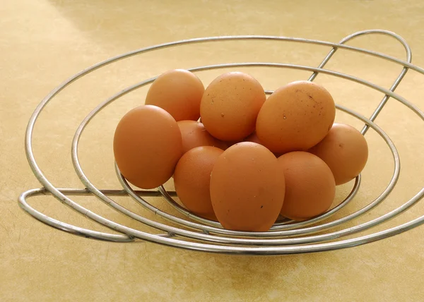 stock image Eggs in a wire basket