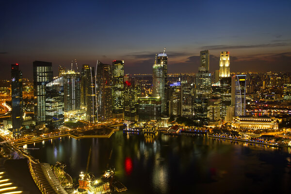 Singapore City Skyline by River at Dusk Aerial View