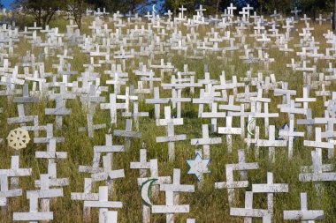 White crosses on a hillside clipart