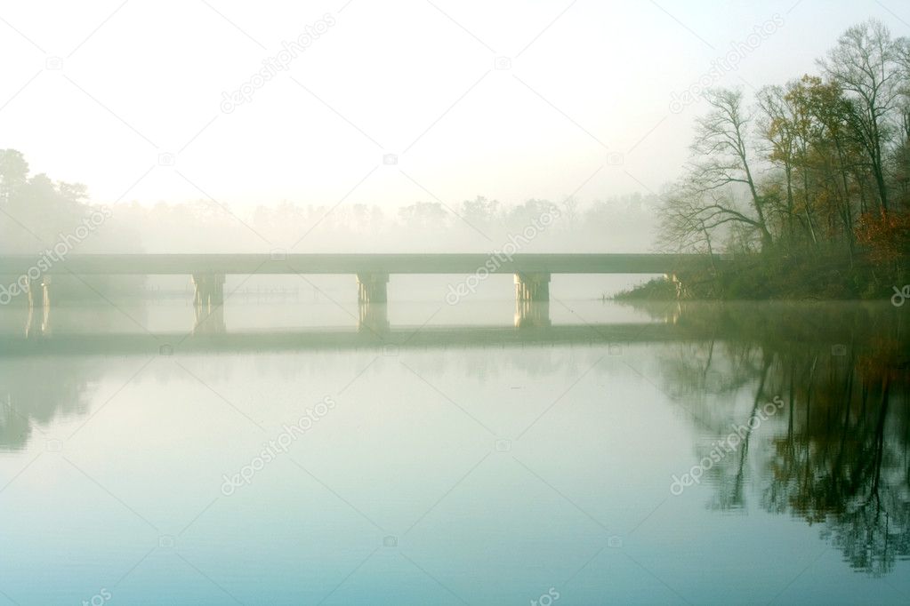 Bridge over a creek in the mist
