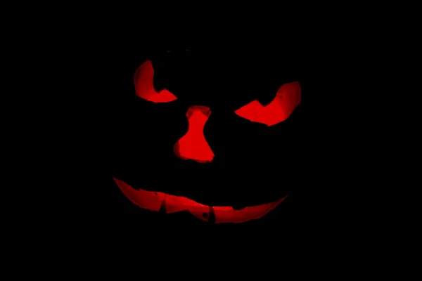 Orange glow of a jack o'lantern face — Stock Photo, Image
