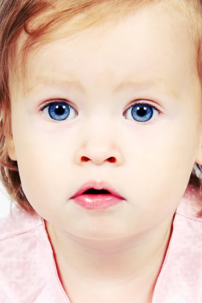 Bebê menina no vestido com olhos brilhantes — Fotografia de Stock