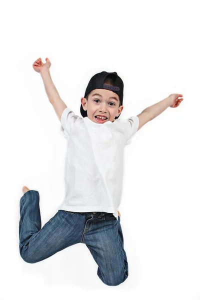 Liten pojke hoppar på isolerade vit bakgrund — Stockfoto
