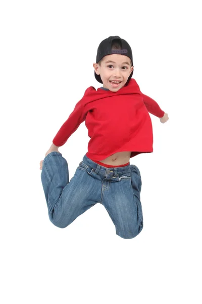 Kleiner Junge springt auf isoliertem weißen Hintergrund — Stockfoto