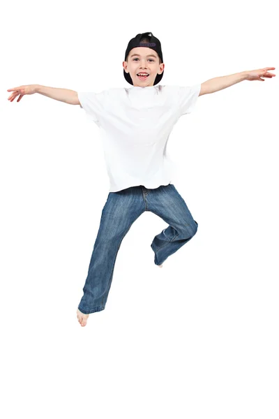 Niño saltando sobre fondo blanco aislado — Foto de Stock
