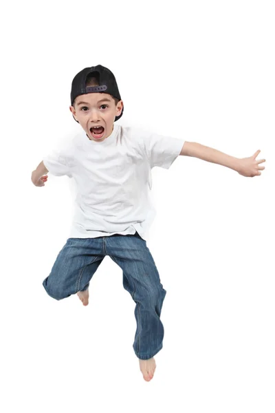 Kleiner Junge springt auf isoliertem weißen Hintergrund — Stockfoto