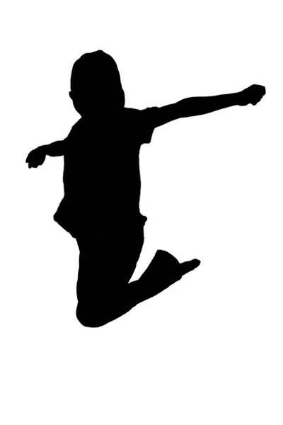 Silhouette of boy jumping up in the air — Stock Photo, Image