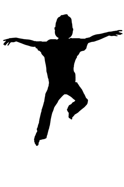 Silhuett av pojke hoppar upp i luften — Stockfoto