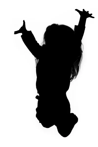 Silhouette of girl jumping up in the air — Stock Photo, Image