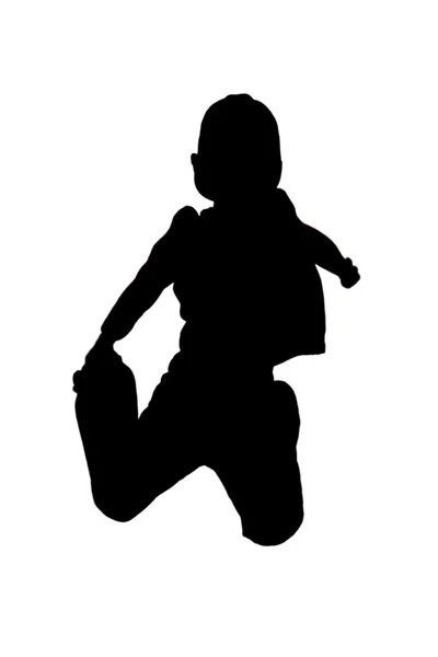 Silhouette eines Jungen, der in die Luft springt — Stockfoto