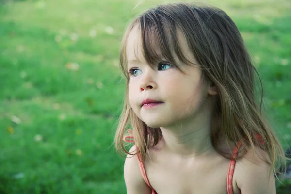Adorable little girl taken closeup outdoors in s — Stock Photo, Image
