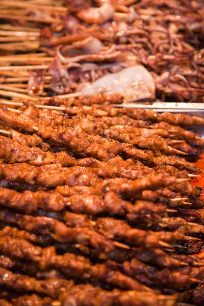 stock image Roasted meat on wood sticks