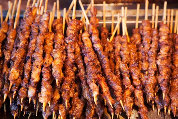 stock image Roasted meat on wood sticks