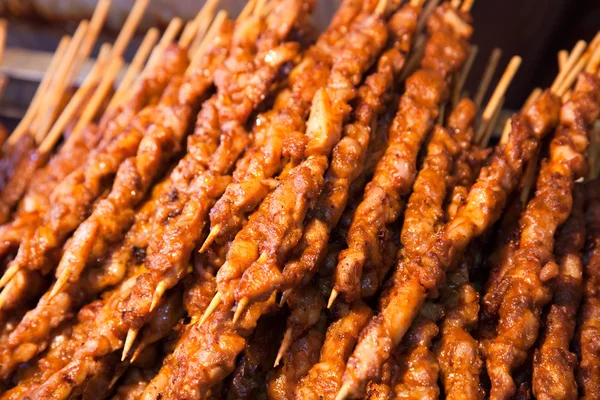 stock image Roasted meat on wood sticks