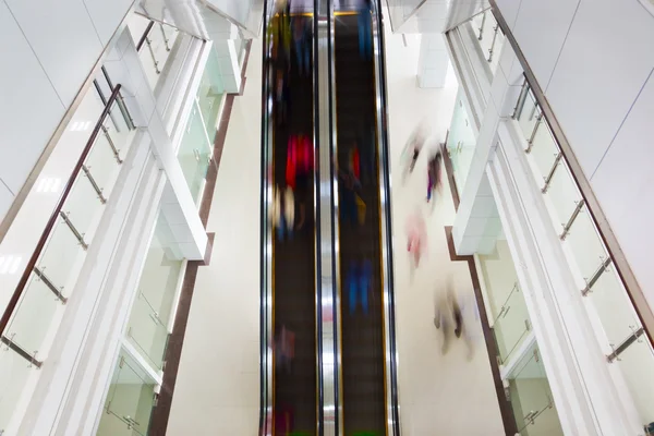 Motion blurred on escalator — Stock Photo, Image