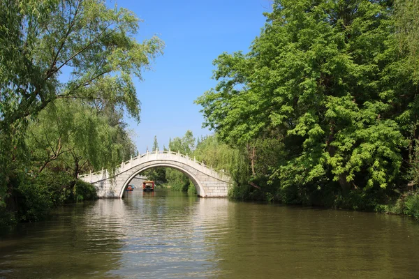 stock image White stone footbridge in an Asian garden