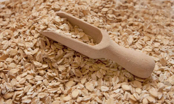 Oat groats and scoop — Stock Photo, Image