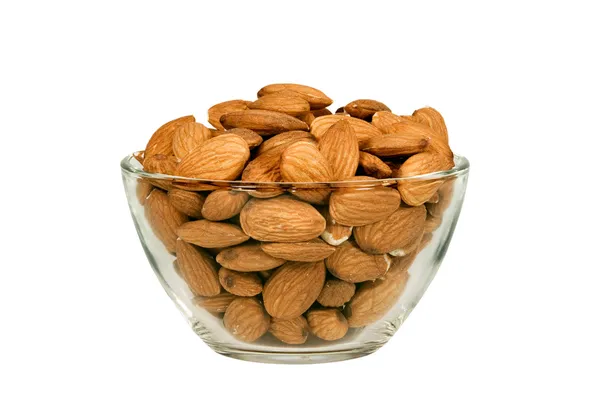 Almonds in a glass bowl Royalty Free Stock Photos