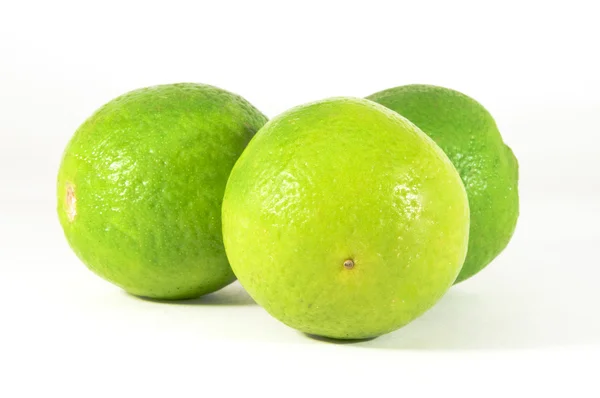 Tre limefrukter — Stockfoto