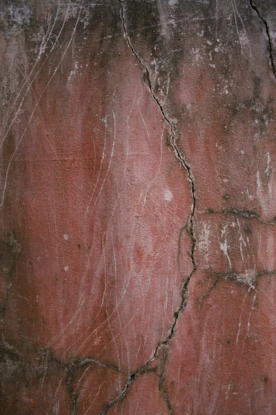 Rote rissige Grunge-Wand — Stockfoto