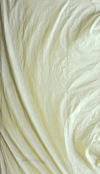 Tela cerata bianca con vortici e pieghe angolari — Foto Stock