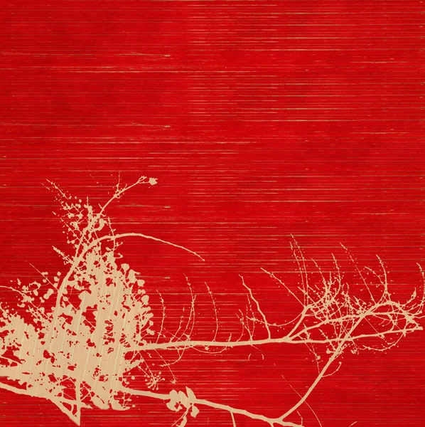 Blütensilhouette auf rotem geripptem handgeschöpftem Papier Hintergrund — Stockfoto