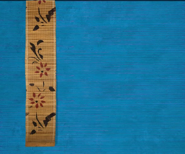 Flor banner de bambu no fundo azul — Fotografia de Stock