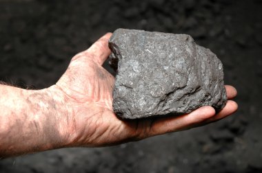 Coal in miner's hand clipart