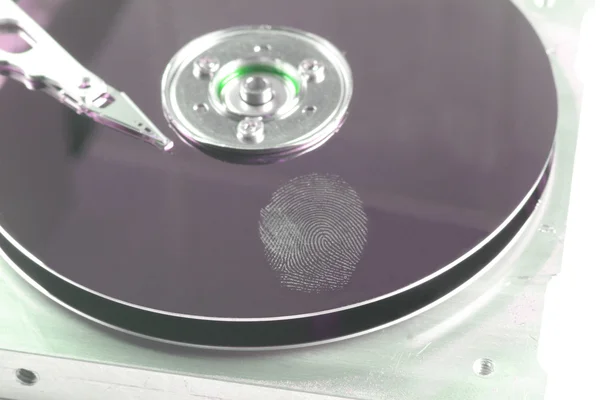 Жесткий диск и отпечатки пальцев — стоковое фото