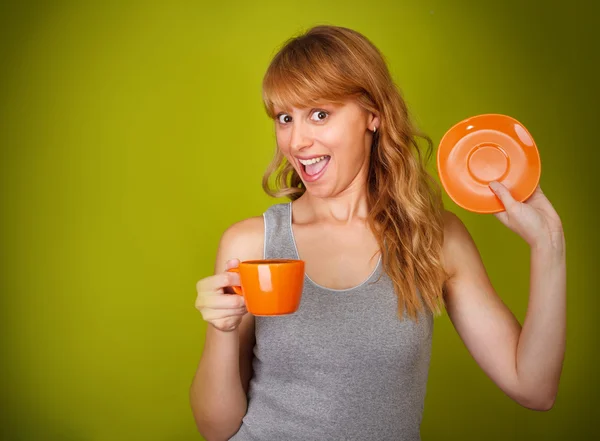 Excited woman with a cup of coffee — Stock Photo, Image