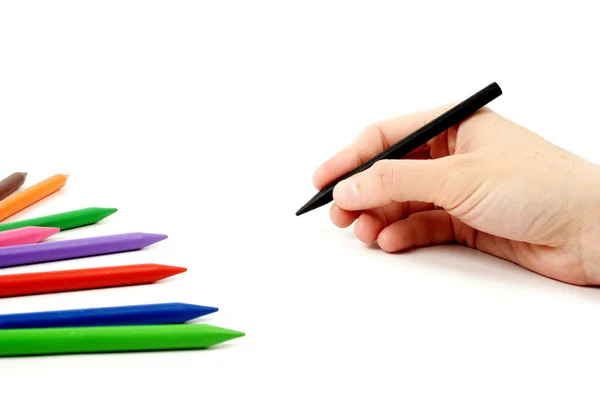 Black pencil in hand — Stock Photo, Image