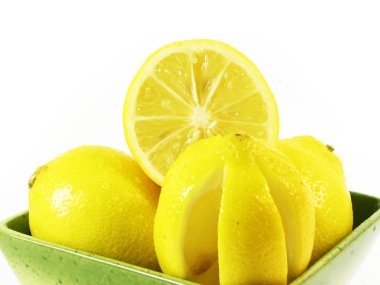 Lemons fruits in green bowl