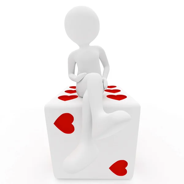 Dívka sedící na bílé kostky v srdcích — Stock fotografie