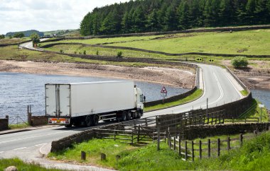 Truck, driving on the road clipart