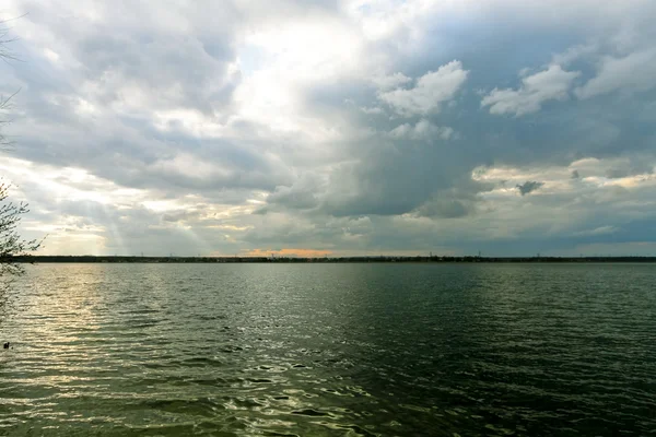 stock image Storm clouds over lake