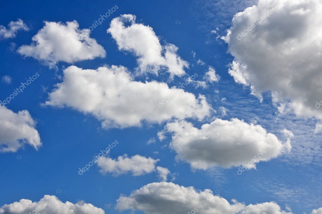 White cumulus clouds and a blue sky — Stock Photo © WDGPhoto #3354487