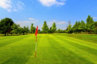 Beautiful golf course and blue sky clipart