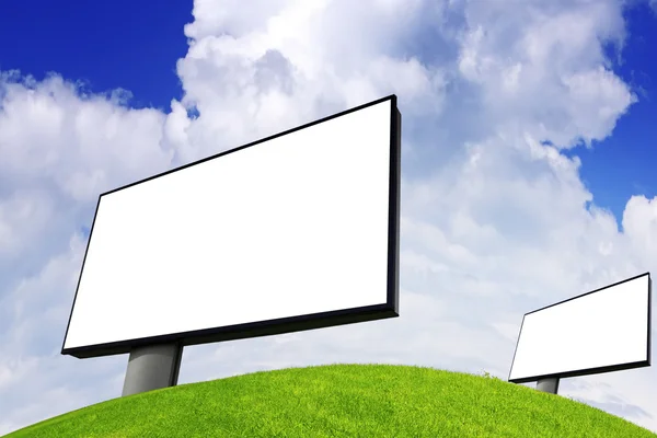 Advertising billboard on green field — Stock Photo, Image