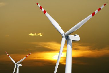 Wind turbine farm at sunset clipart