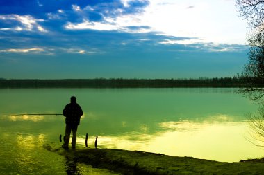 Fishing in a lake clipart