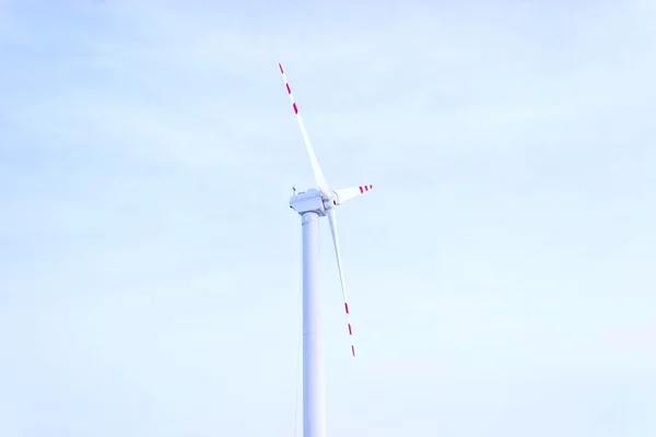 stock image Wind turbines on green field. Alternative source of energy