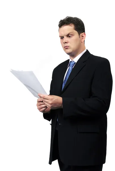 Angry businessman reading financial repo Royalty Free Stock Photos