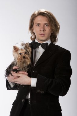 Elegant gentleman holding his cute puppy clipart