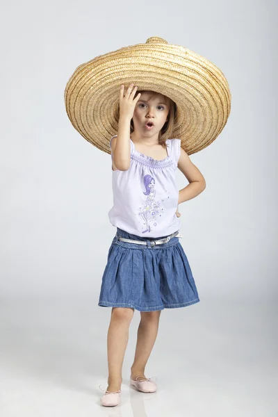 Mexican little 5 years old girl wearing big hat sumbrero — Zdjęcie stockowe