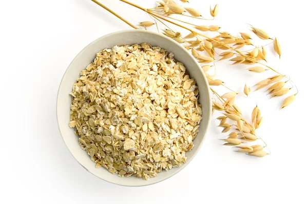 Oat flakes and oat stems — Stock Photo, Image