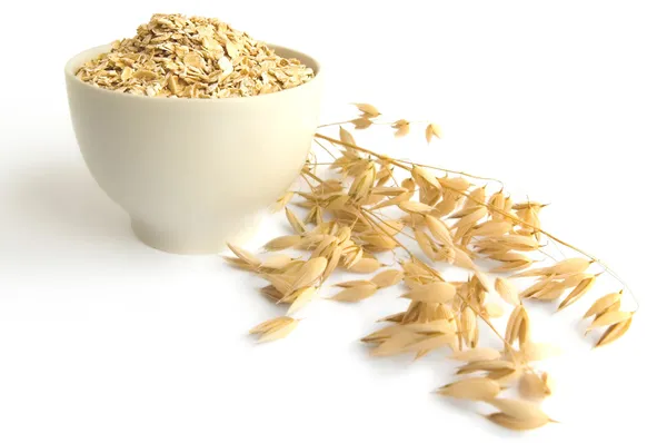 Rolled oats in a teacup — Stock Photo, Image