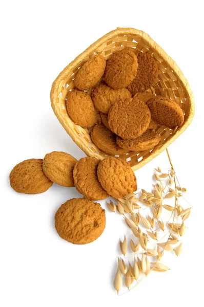 Oatmeal cookies spilled from the basket — Stock Photo, Image