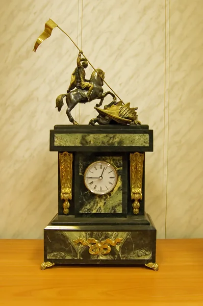 Clock with a sculpture — Stock Photo, Image