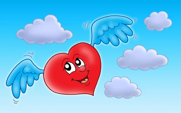 Flying heart on blue sky — Stock Photo, Image