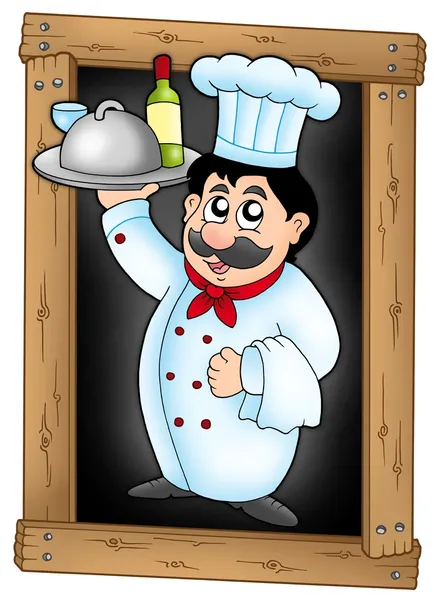 Chef holding meal on blackboard — Stock Photo, Image